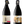 Two wine bottles with labels featuring images of people on a white background